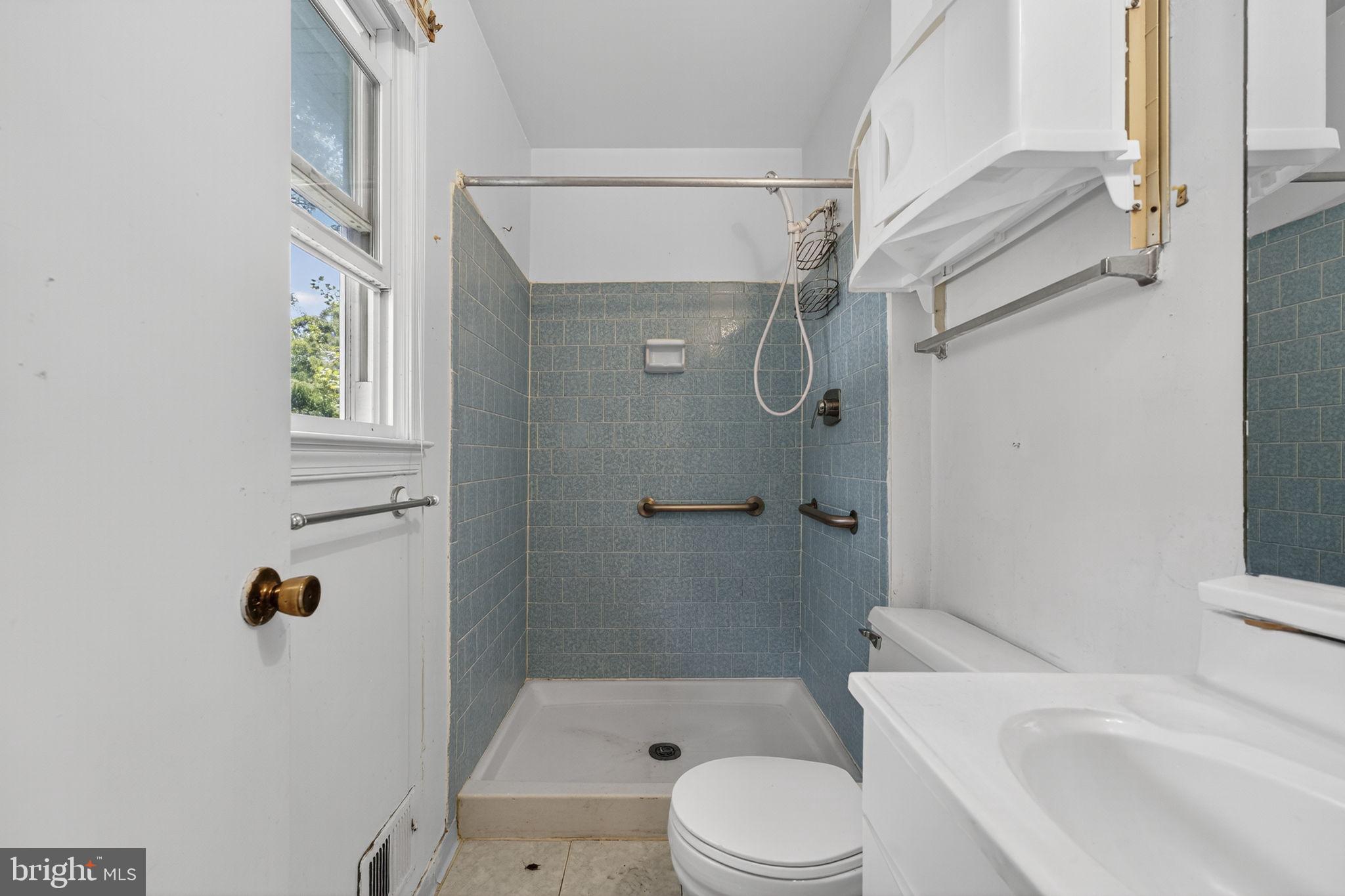 7124 Whetstone Road Alexandria, VA 22306 - Photo 20 of 39 Bathroom with a shower and a toile