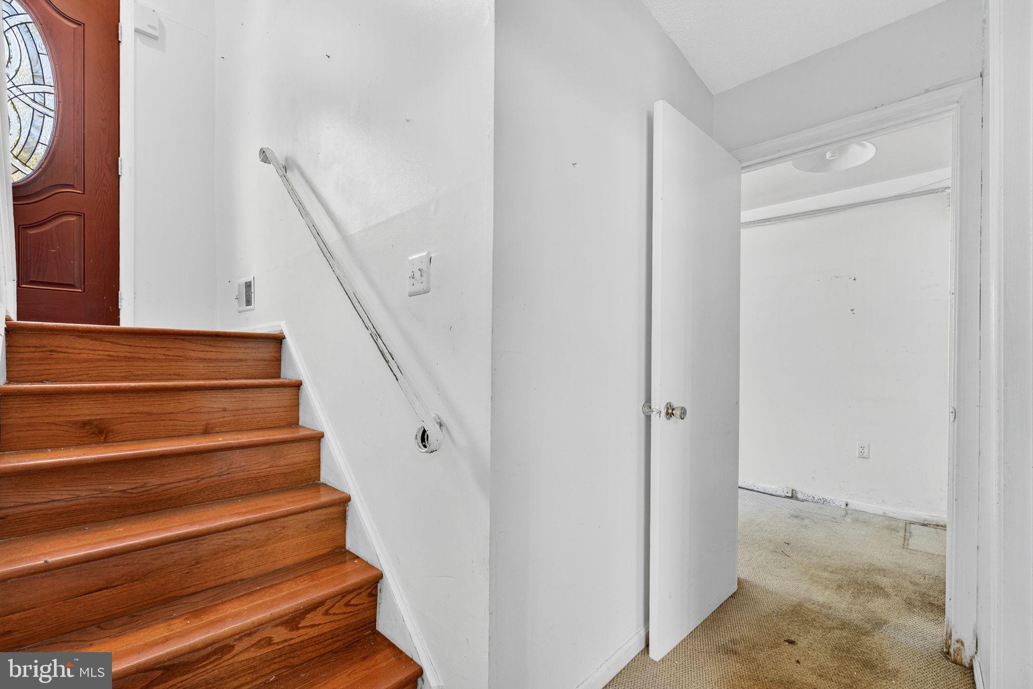 7124 Whetstone Road Alexandria, VA 22306 - Photo 24 of 39 A classic staircase connecting the home’s levels