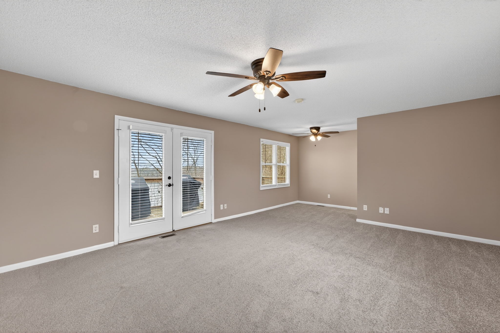 232 Loop Drive Winchester, TN 37398 - Photo 16 of 41 a view of a big room with windows and chandelier fan