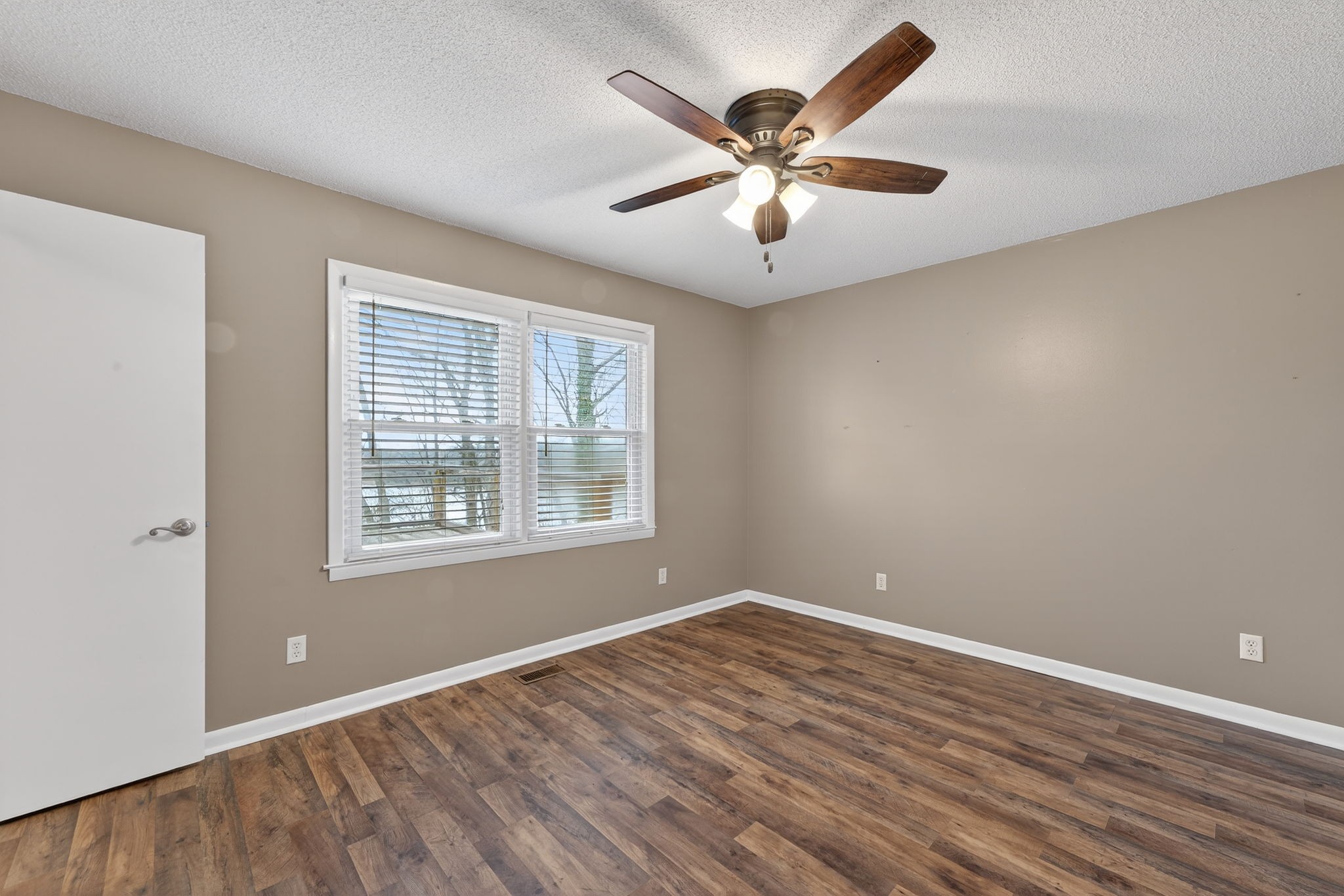 232 Loop Drive Winchester, TN 37398 - Photo 18 of 41 an empty room with wooden floor and windows