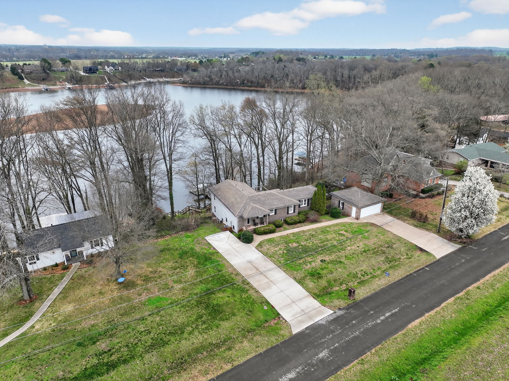 232 Loop Drive Winchester, TN 37398 - Photo 26 of 41 a view of a backyard with plants and lake