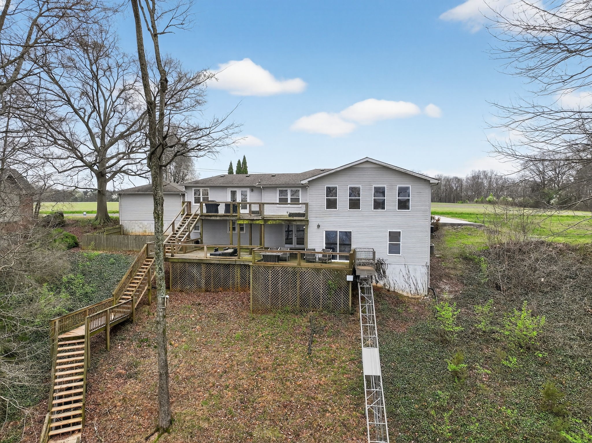232 Loop Drive Winchester, TN 37398 - Photo 33 of 41 a view of a big house with a big yard and large trees