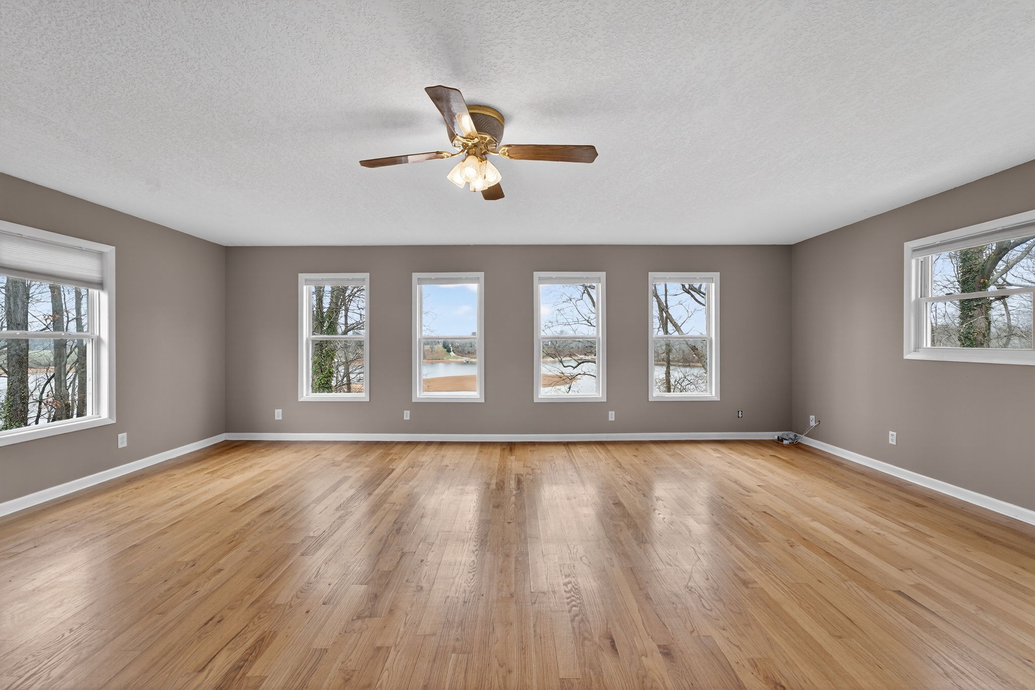 232 Loop Drive Winchester, TN 37398 - Photo 5 of 41 a view of an empty room with a window and wooden floor