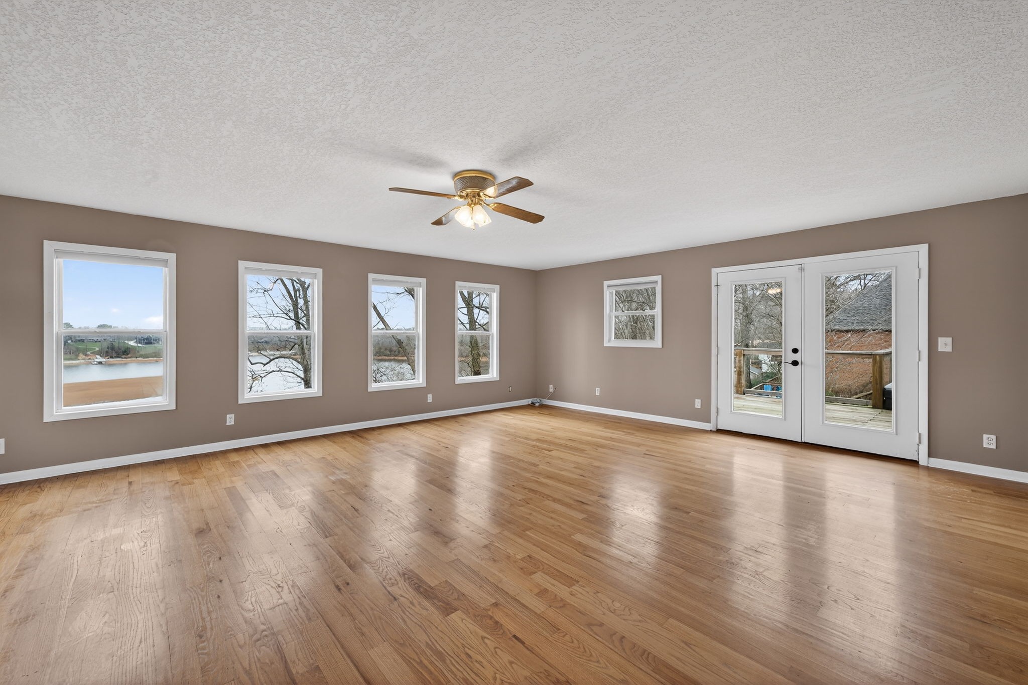 232 Loop Drive Winchester, TN 37398 - Photo 8 of 41 a view of an empty room with a window and wooden floor
