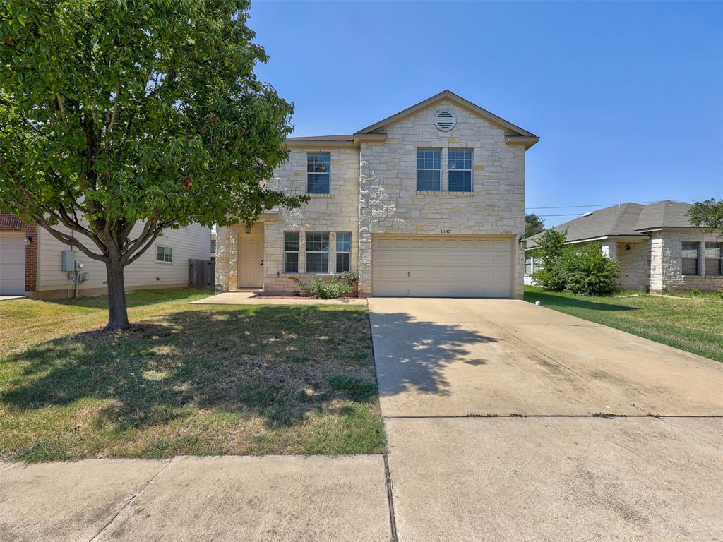 1145 Apollo Circle Round Rock, TX 78664 - Photo 1 of 1 a front view of a house with a yard