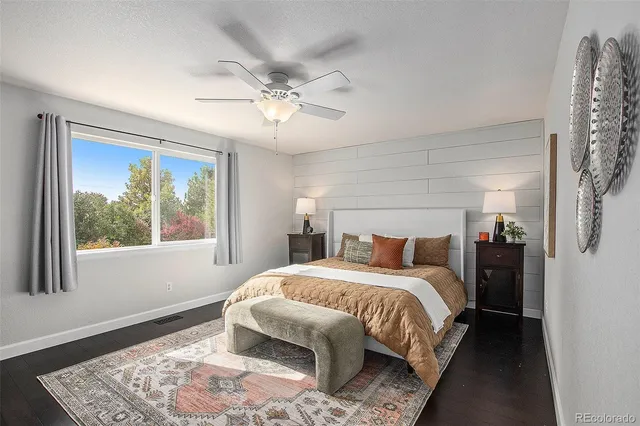 a bedroom with a large bed and a window