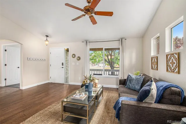 a living room with furniture and a window