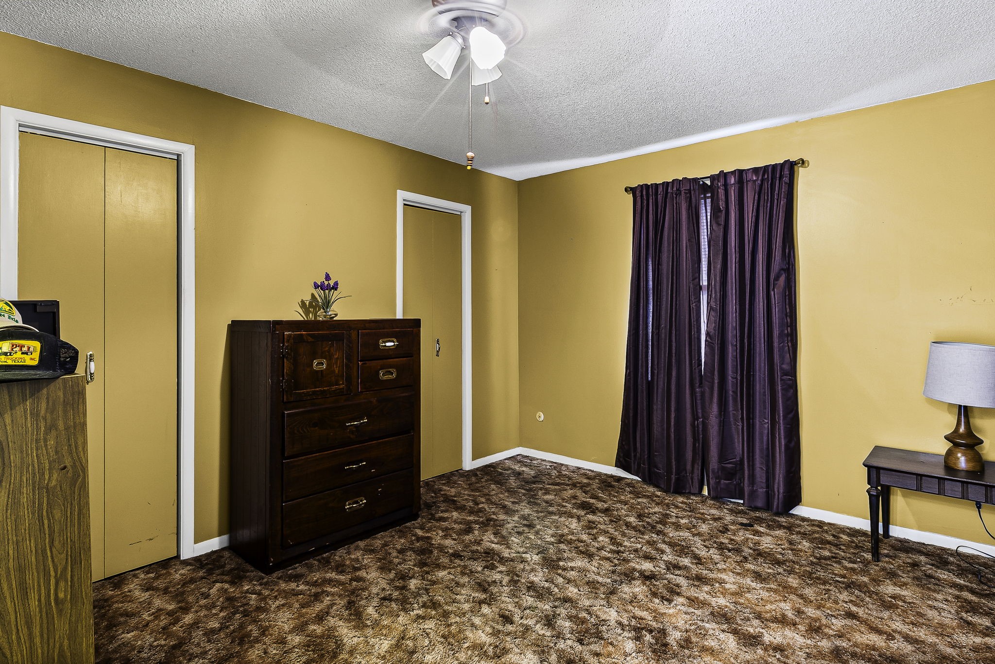 271 Ivanhoe Ranchettes Drive Ivanhoe, TX 75979 - Photo 29 of 40 a bedroom with a bed and a dresser