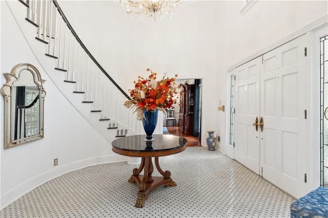 a hallway with windows and wooden floor
