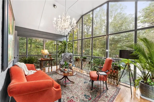 a bedroom with furniture and a wooden floor