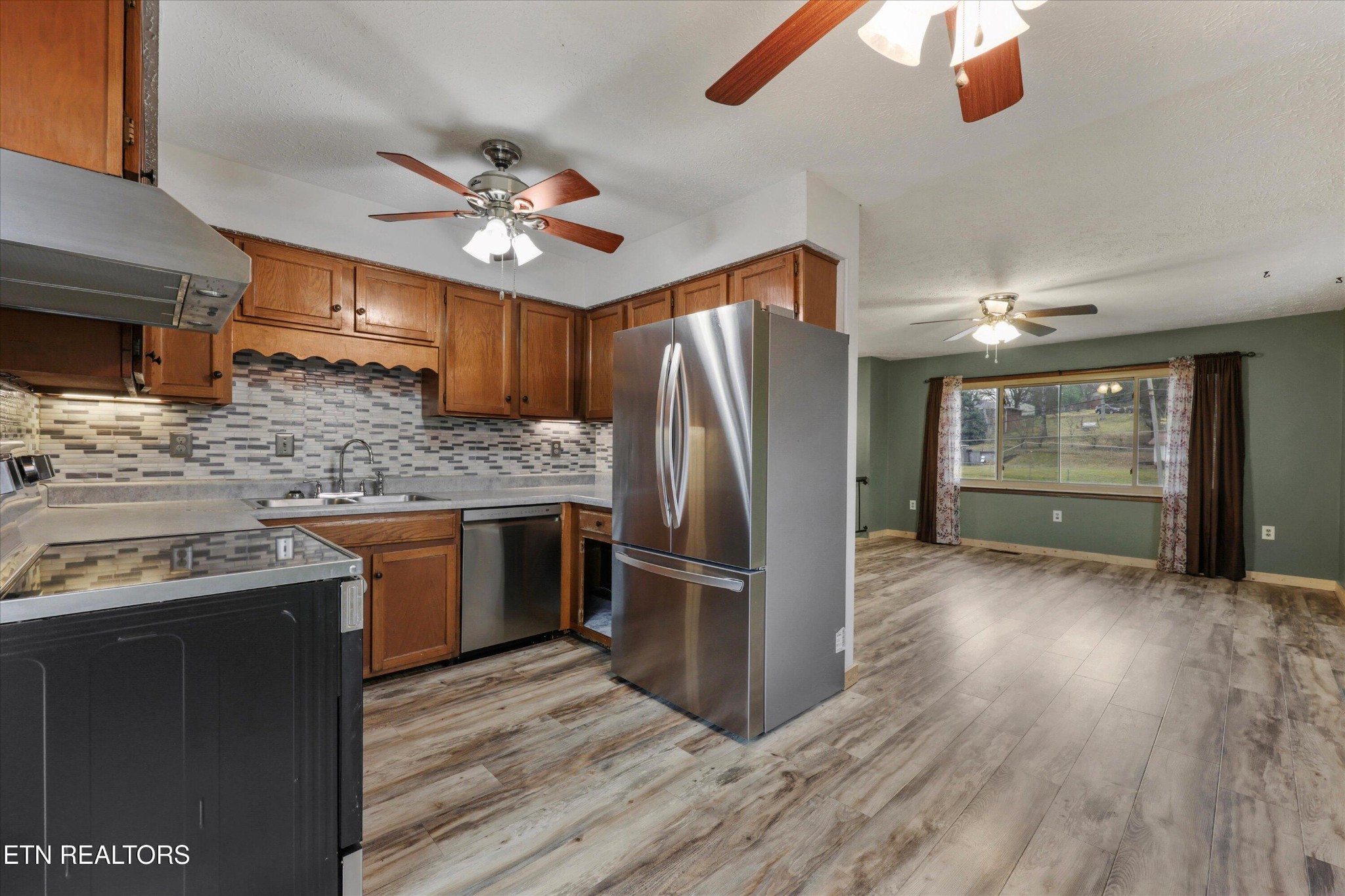 47 Paint Rock Ferry Road Kingston, TN 37763 - Photo 7 of 38 a kitchen with stainless steel appliances granite countertop a refrigerator a sink and a stove