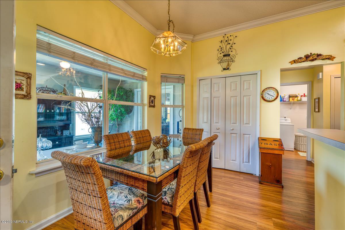 1372 Blackmon Road Green Cove Springs, FL 32043 - Photo 12 of 26 a dining room with furniture and wooden floor