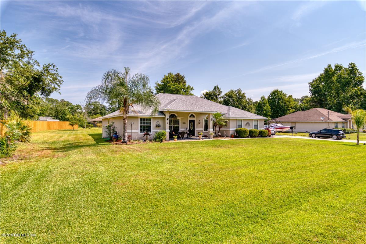 1372 Blackmon Road Green Cove Springs, FL 32043 - Photo 2 of 26 a front view of a house with a big yard