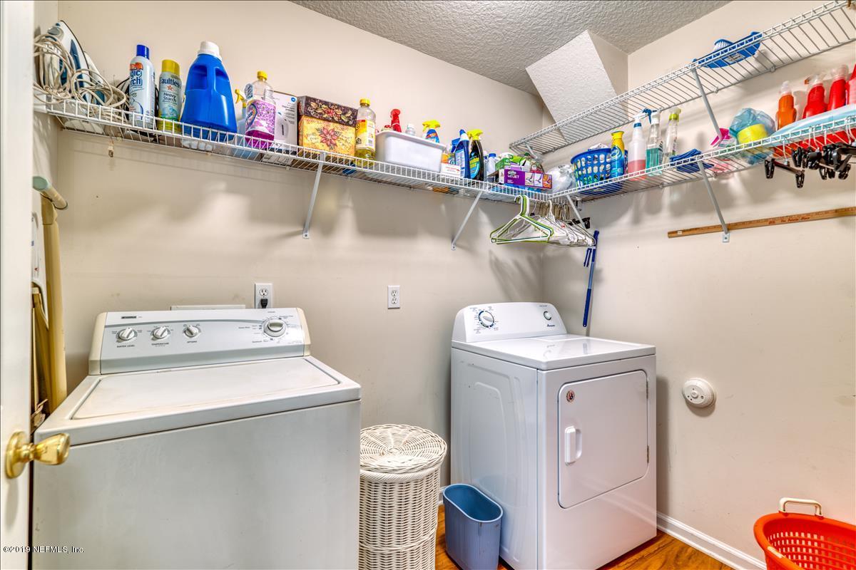 1372 Blackmon Road Green Cove Springs, FL 32043 - Photo 23 of 26 a utility room with dryer and washer