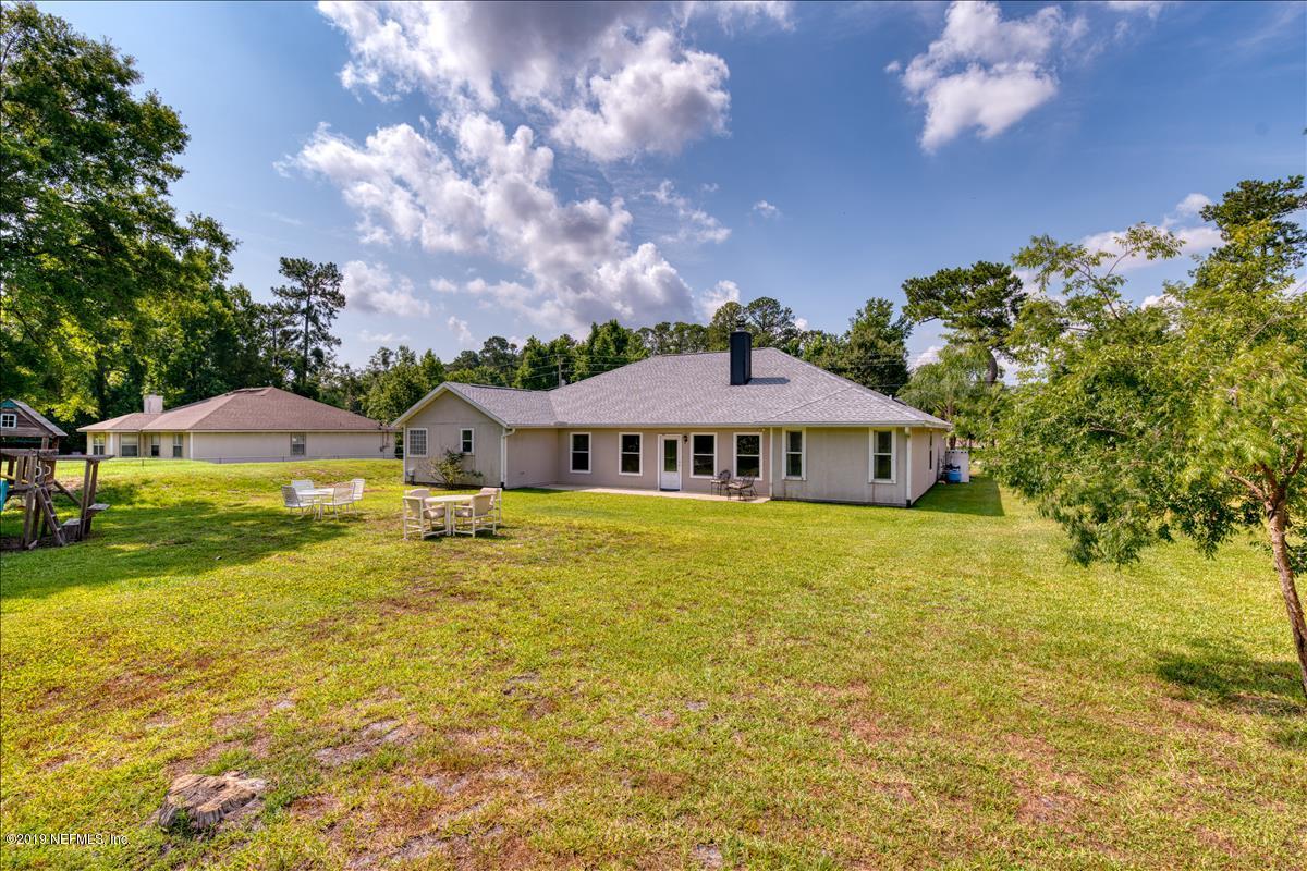 1372 Blackmon Road Green Cove Springs, FL 32043 - Photo 24 of 26 a front view of a house with a big yard