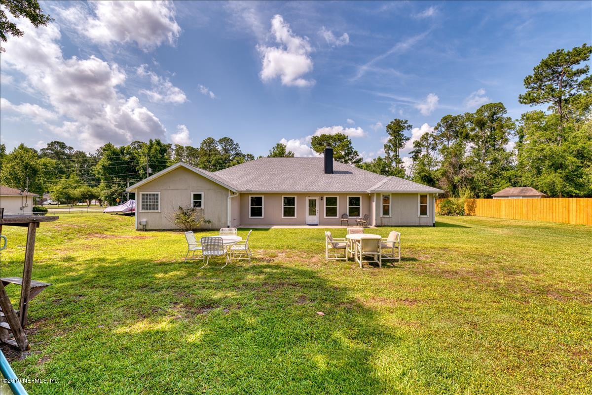 1372 Blackmon Road Green Cove Springs, FL 32043 - Photo 25 of 26 a front view of a house with yard and swimming pool