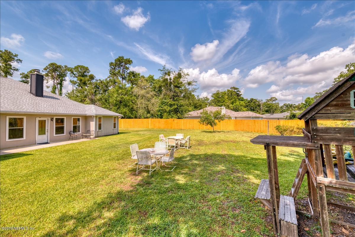 1372 Blackmon Road Green Cove Springs, FL 32043 - Photo 26 of 26 a front view of a house with a yard