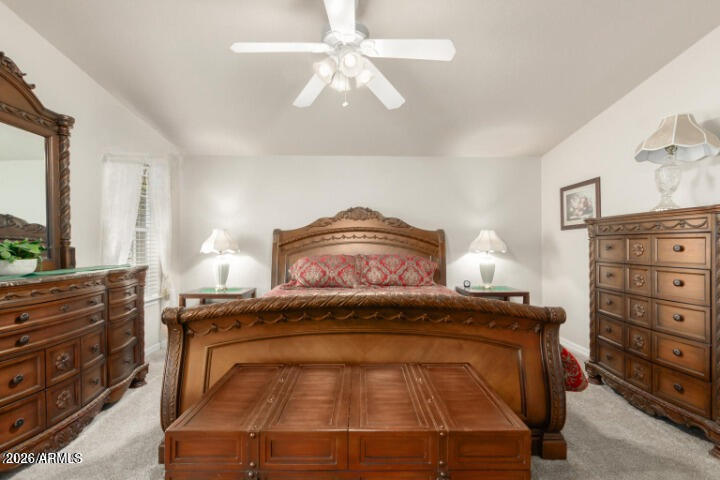 3301 South Goldfield Road, Unit 4086 Apache Junction, AZ 85119 - Photo 8 of 41 a bedroom with a bed and a dresser