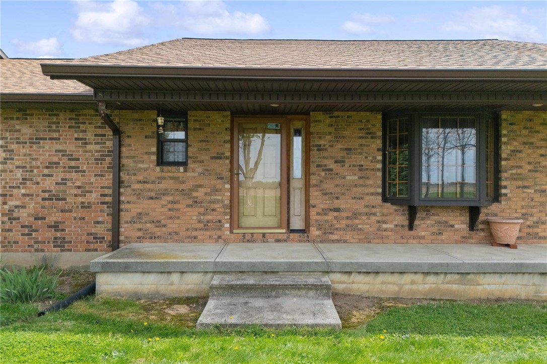 4971 Lackey Road Cedarville, OH 45314 - Photo 45 of 79 This brick facade home features a welcoming front entry with a bay window and practical concrete steps.