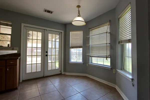 a kitchen with stainless steel appliances granite countertop a sink refrigerator and microwave
