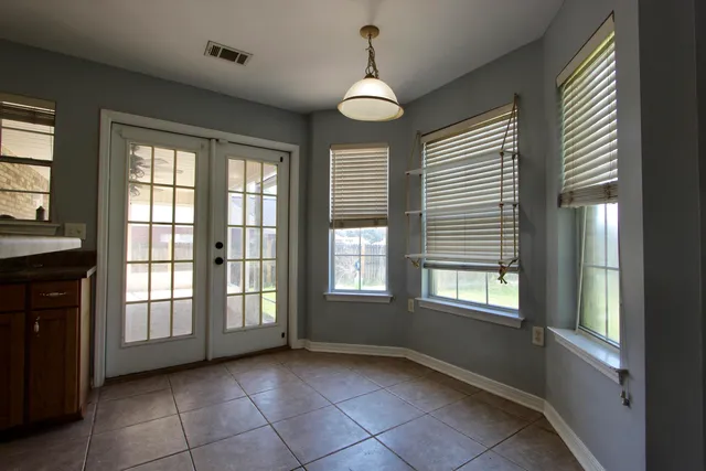 a kitchen with stainless steel appliances granite countertop a sink refrigerator and microwave