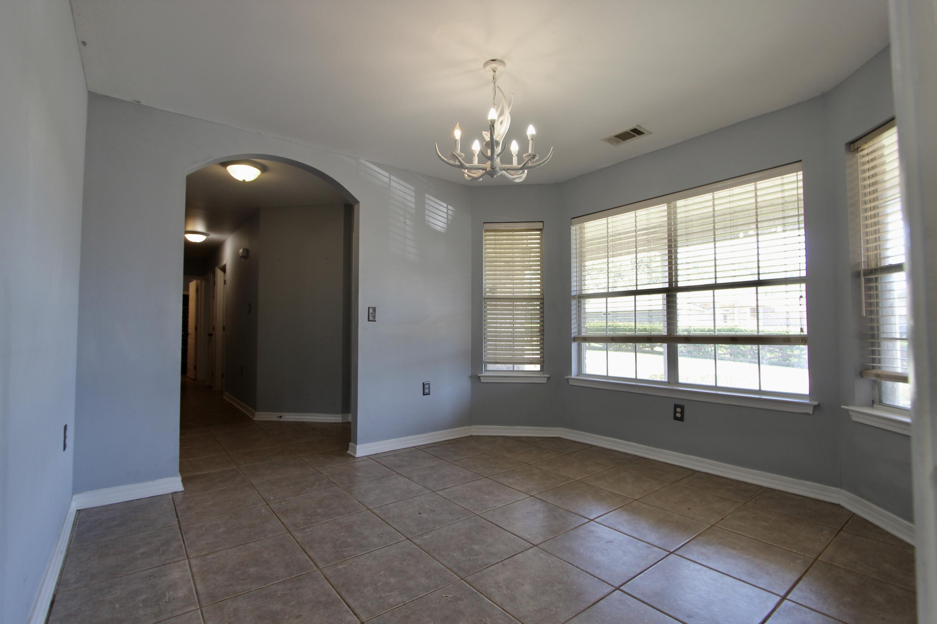 6064 Buckward Road Baker, FL 32531 - Photo 16 of 34 a view of an empty room with a window