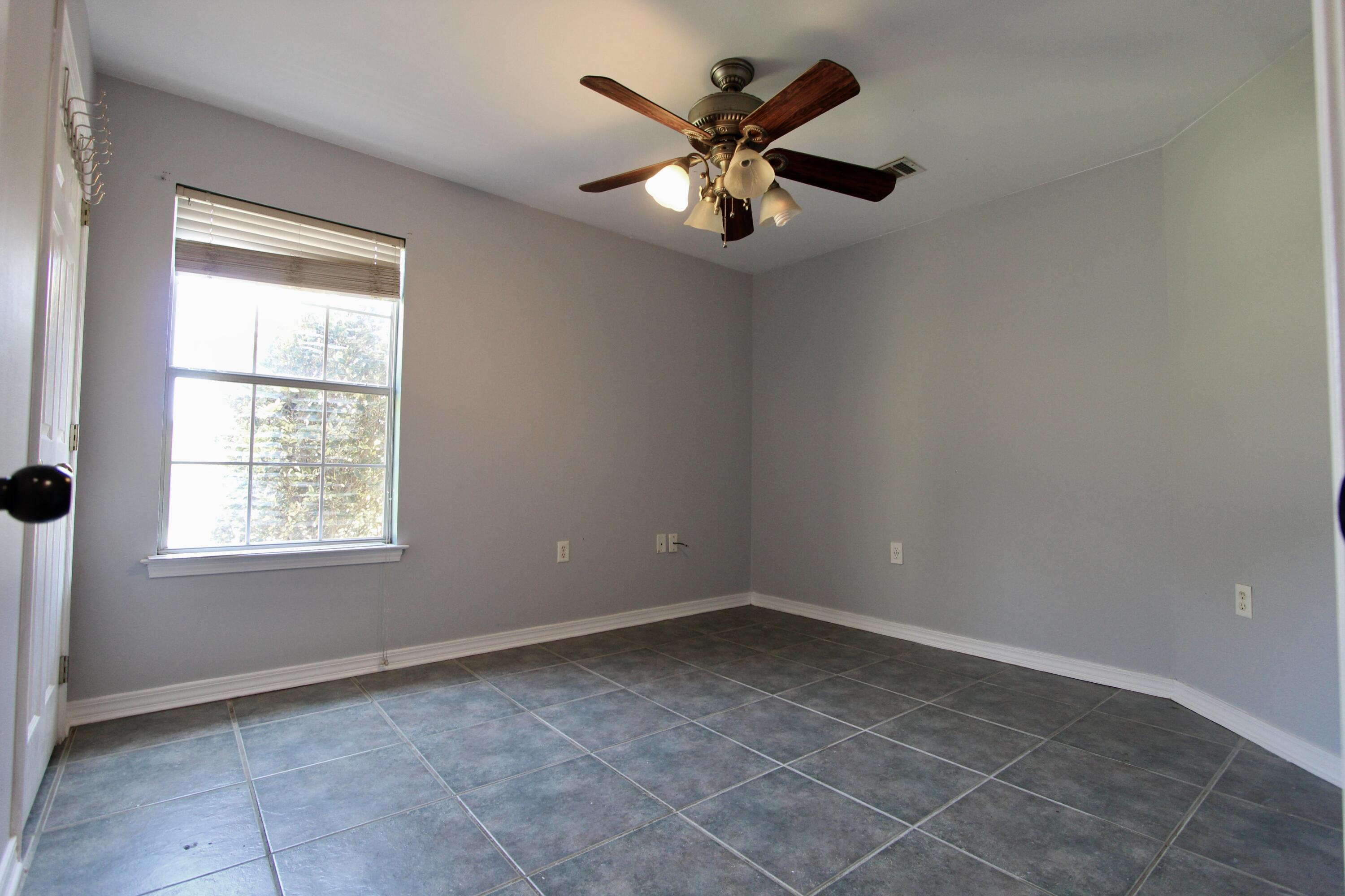 6064 Buckward Road Baker, FL 32531 - Photo 17 of 34 a view of an empty room with a window