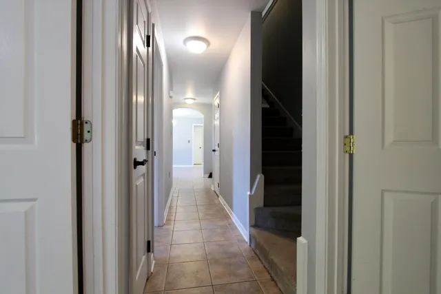 an empty room with a fan & a fan