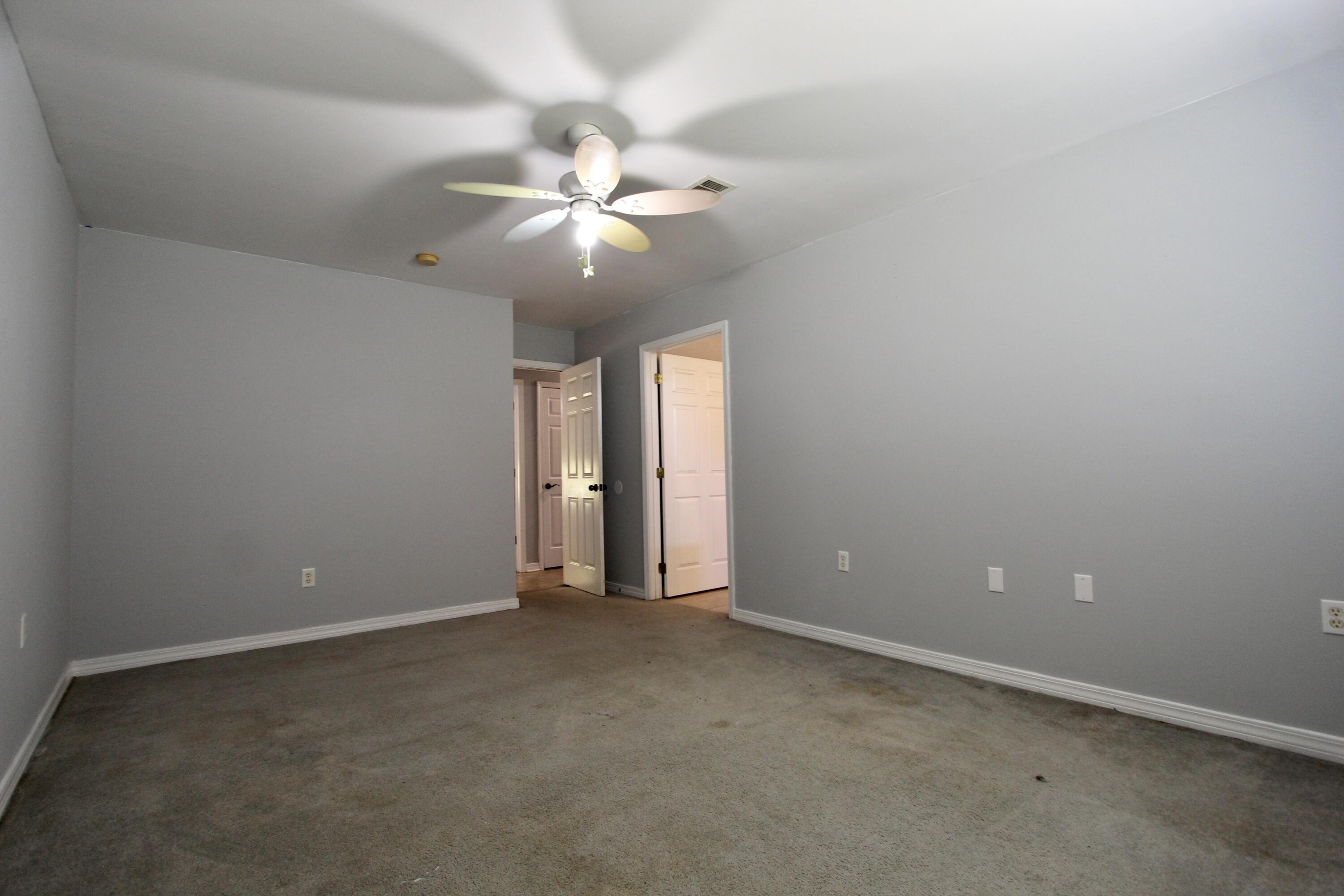 6064 Buckward Road Baker, FL 32531 - Photo 25 of 34 an empty room with a fan & a fan