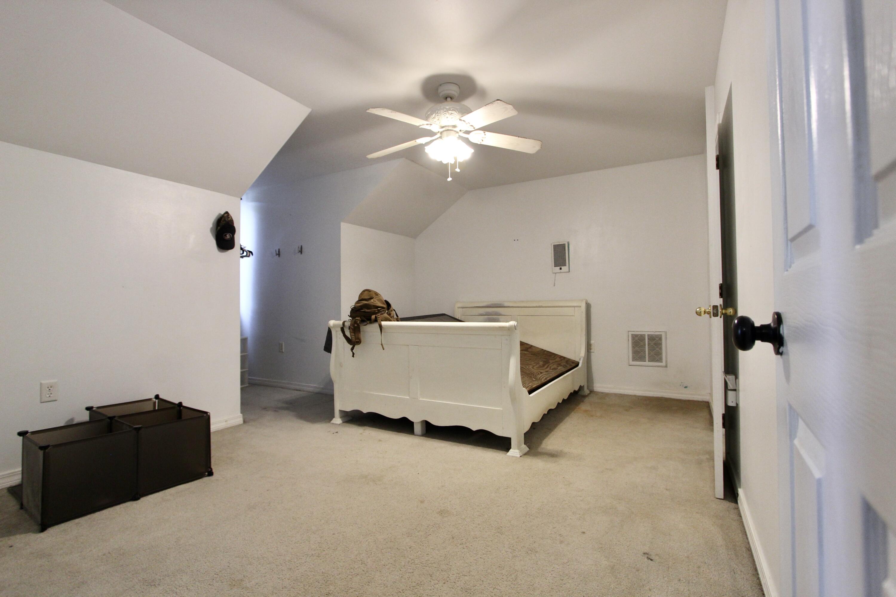 6064 Buckward Road Baker, FL 32531 - Photo 27 of 34 a bed room with a bed and a ceiling fan