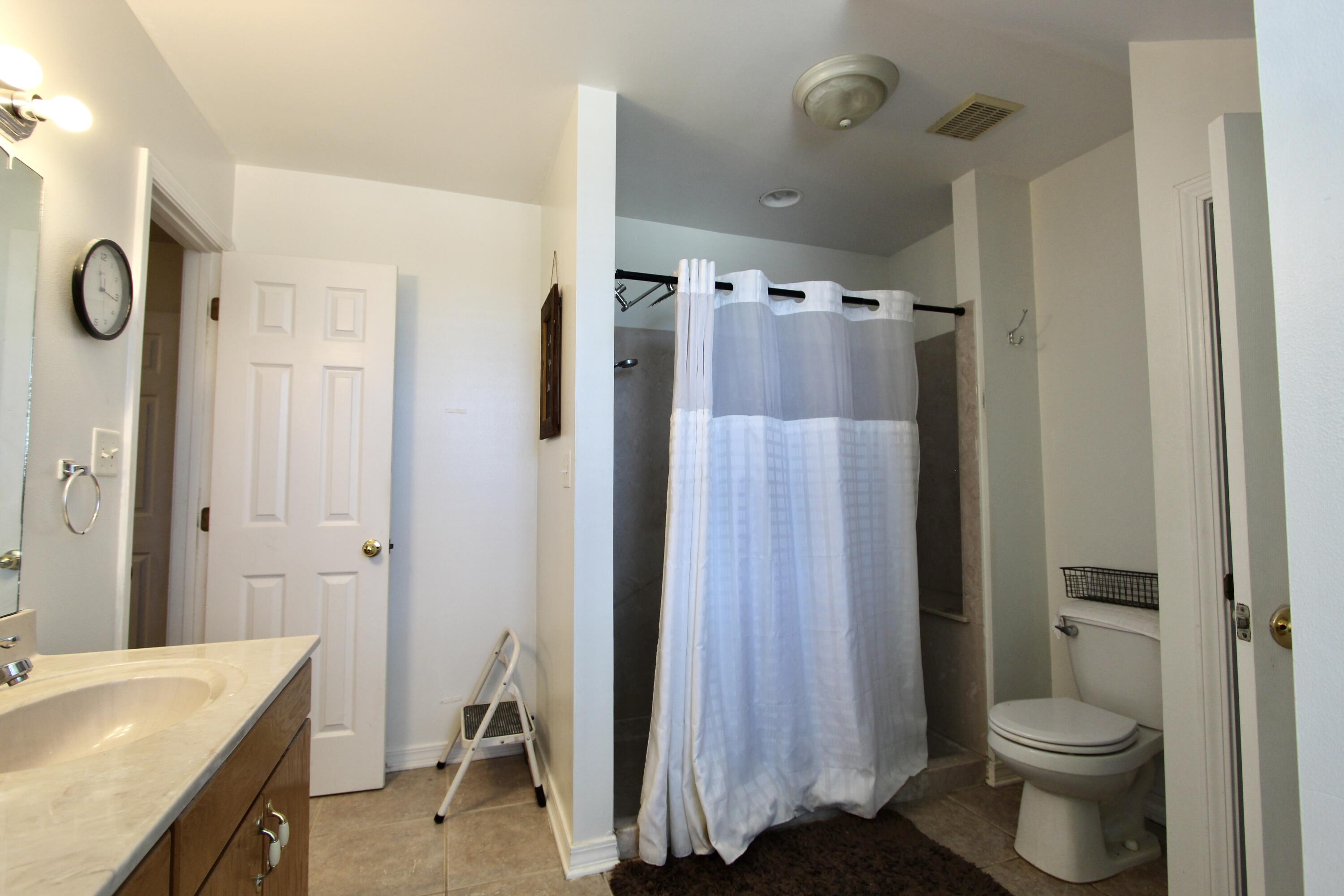 6064 Buckward Road Baker, FL 32531 - Photo 29 of 34 a bathroom with a sink toilet and shower