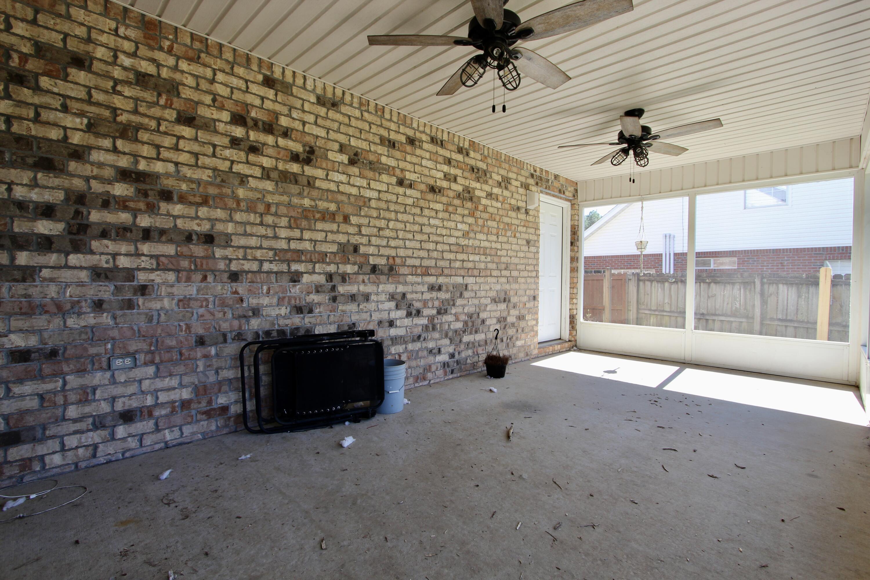 6064 Buckward Road Baker, FL 32531 - Photo 30 of 34 a living room with fireplace