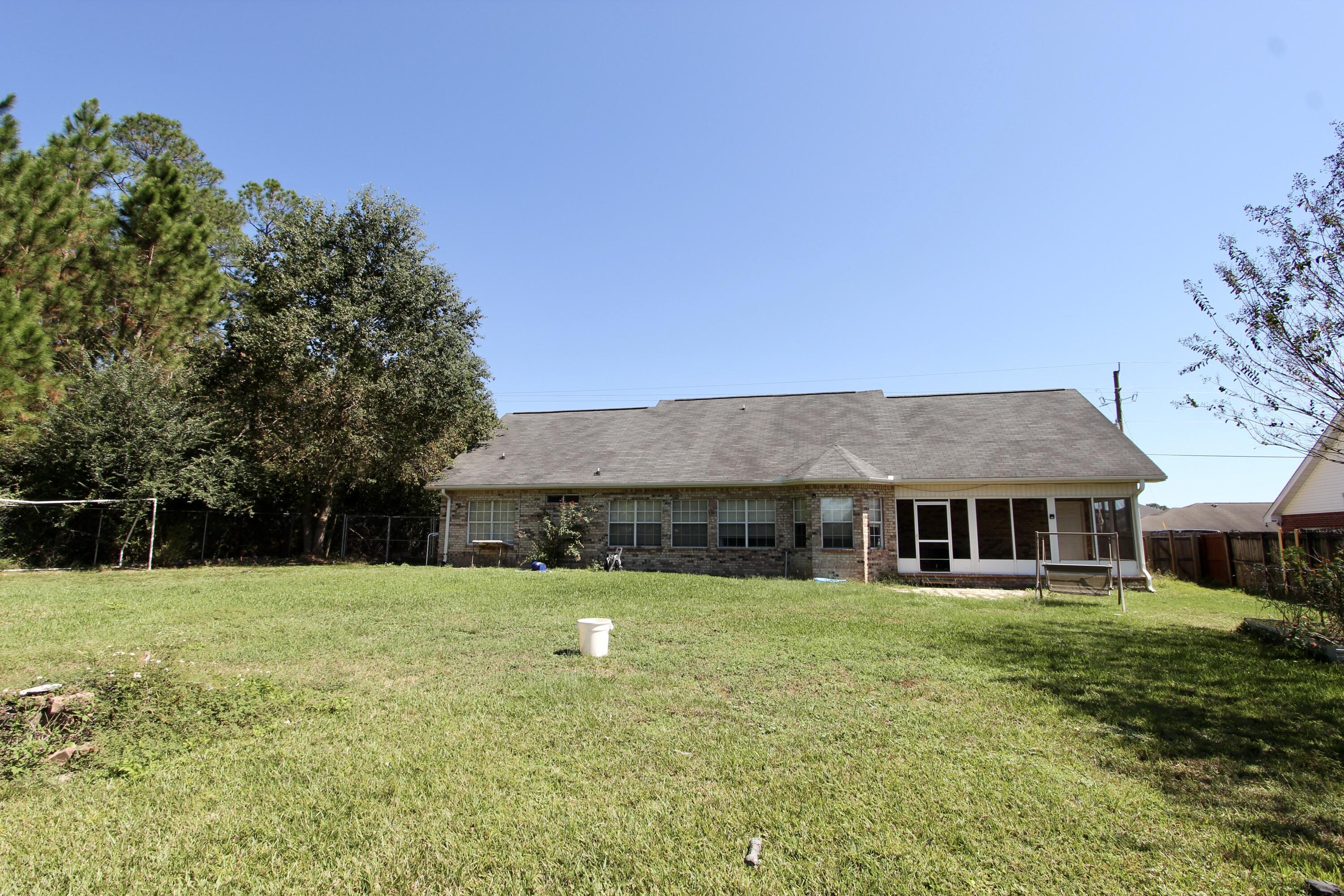 6064 Buckward Road Baker, FL 32531 - Photo 33 of 34 a front view of a house with a yard