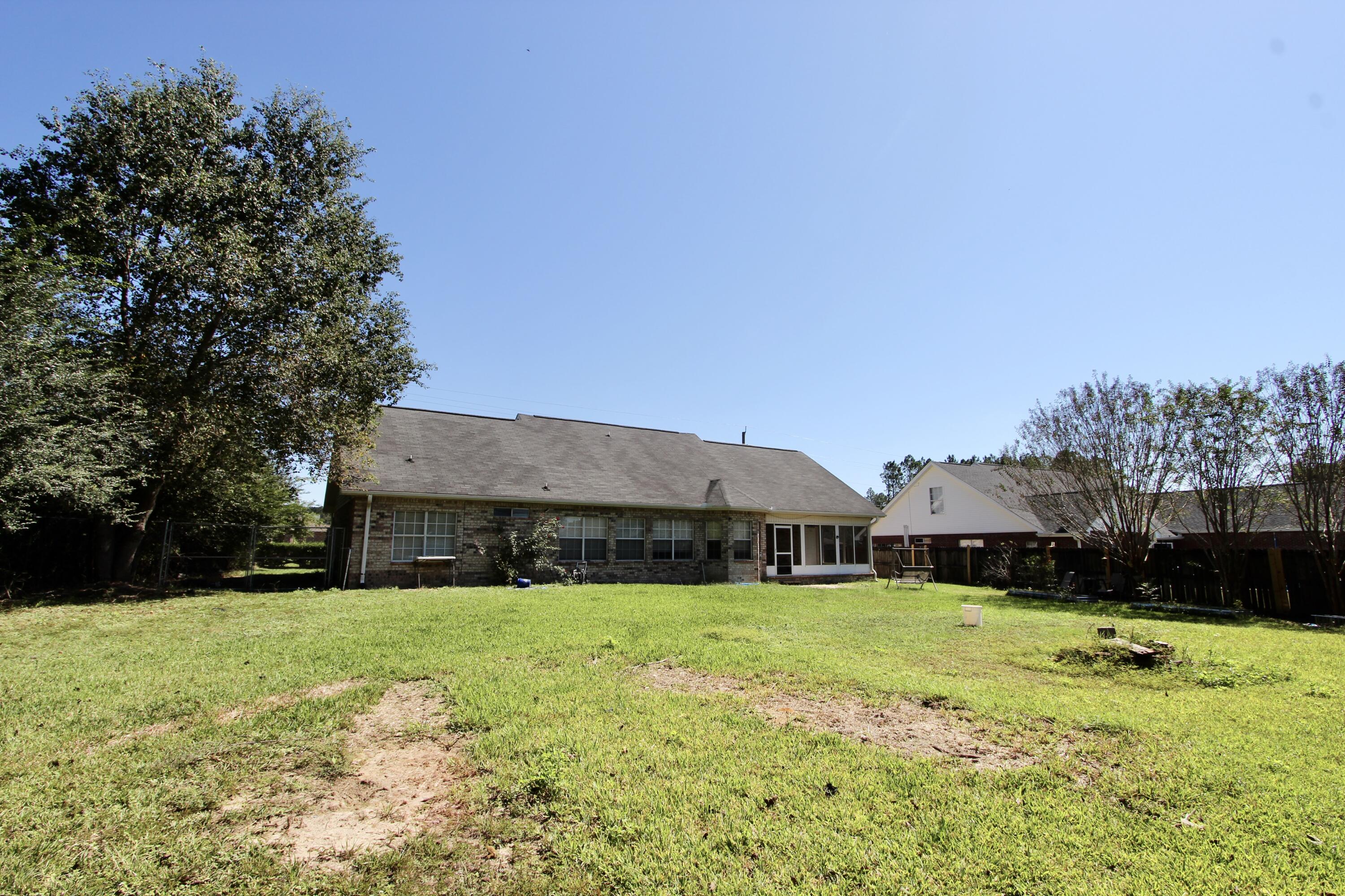 6064 Buckward Road Baker, FL 32531 - Photo 34 of 34 a view of house with garden