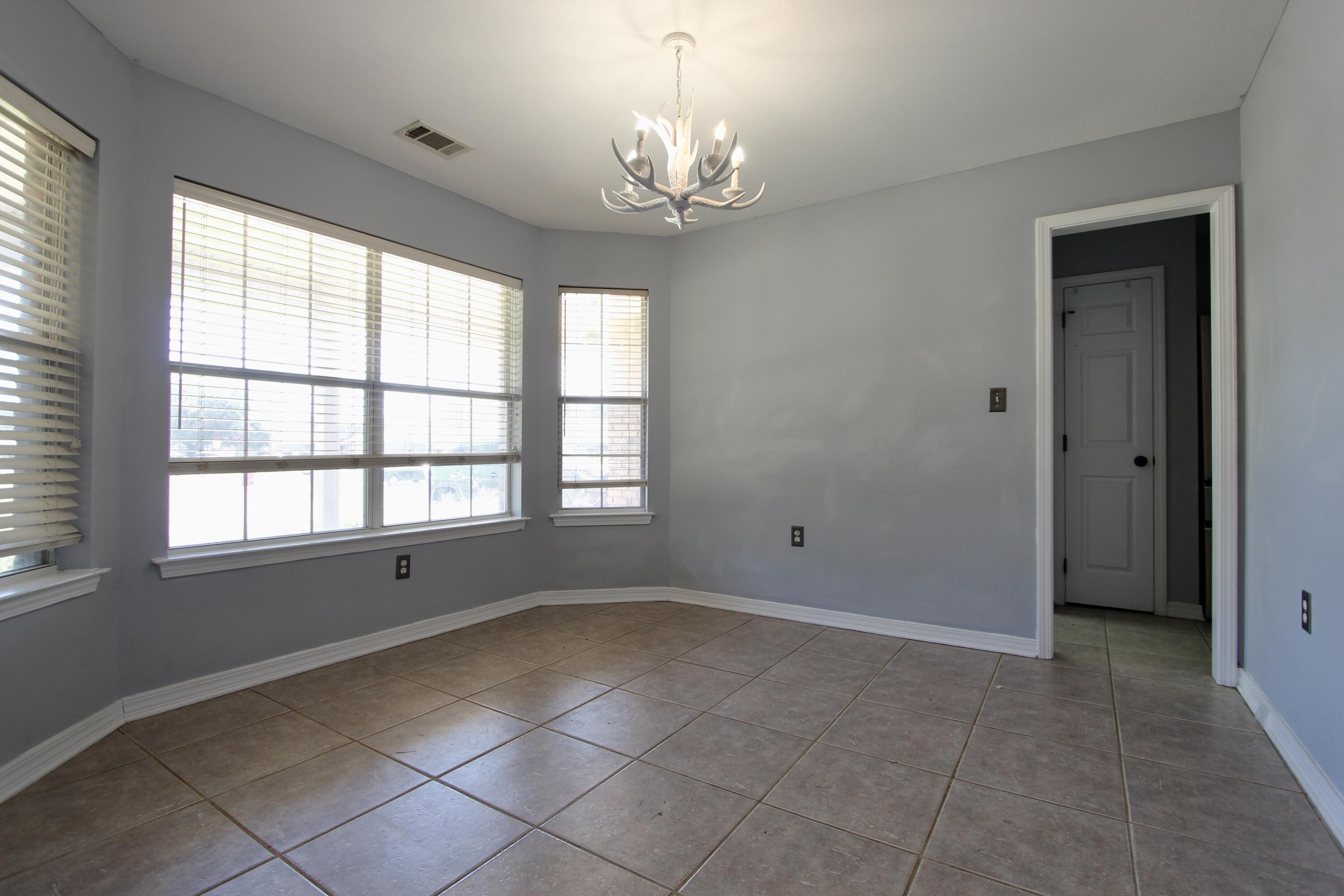6064 Buckward Road Baker, FL 32531 - Photo 6 of 34 a view of an empty room with a window