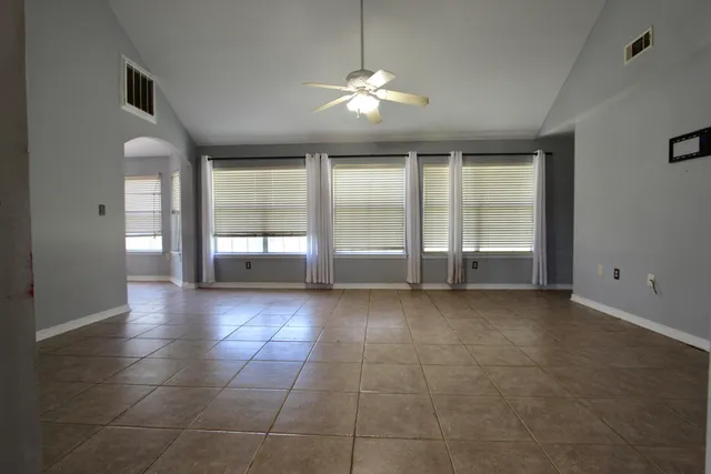 a kitchen with granite countertop a stove a sink and a microwave