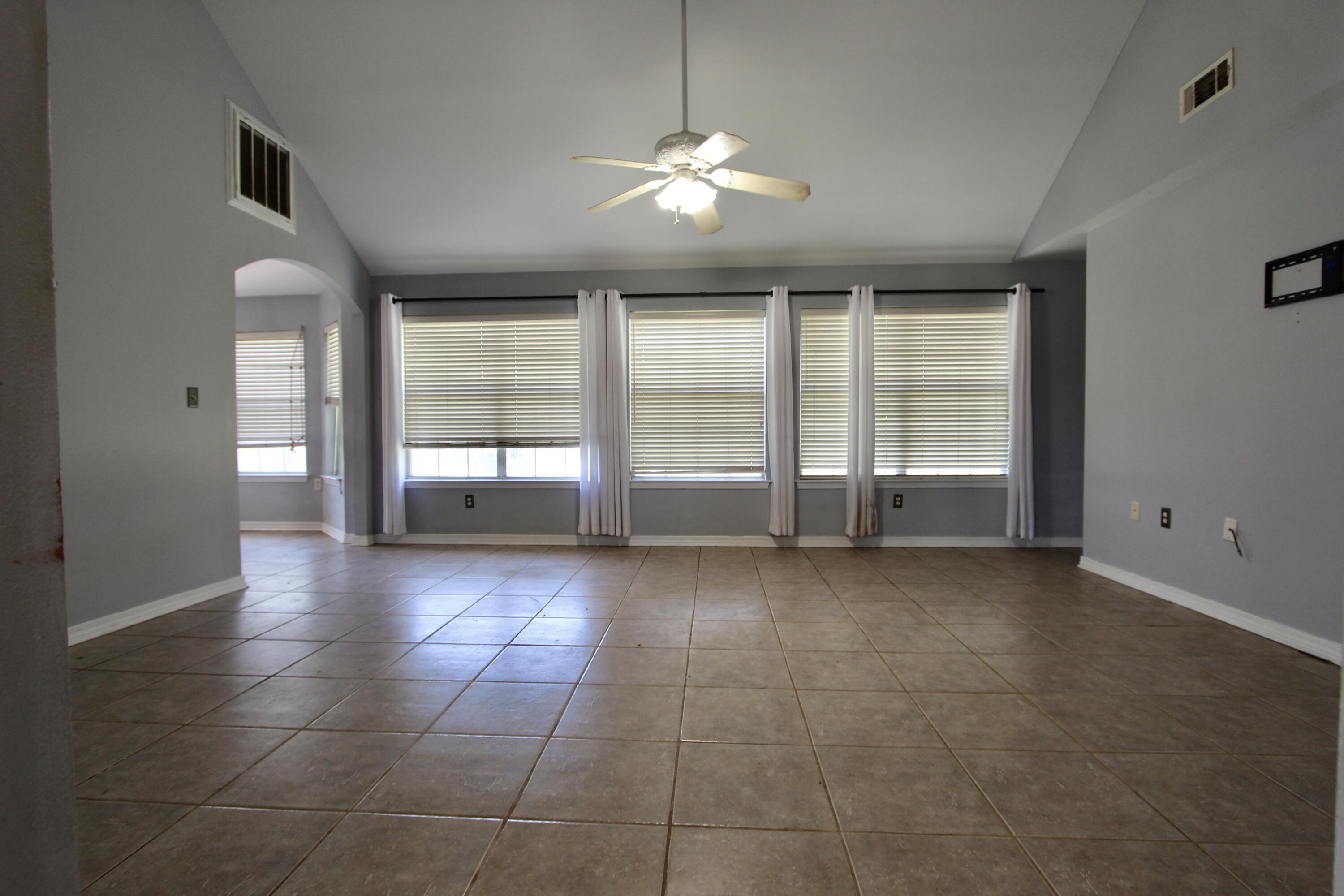 6064 Buckward Road Baker, FL 32531 - Photo 8 of 34 a view of an empty room with a window