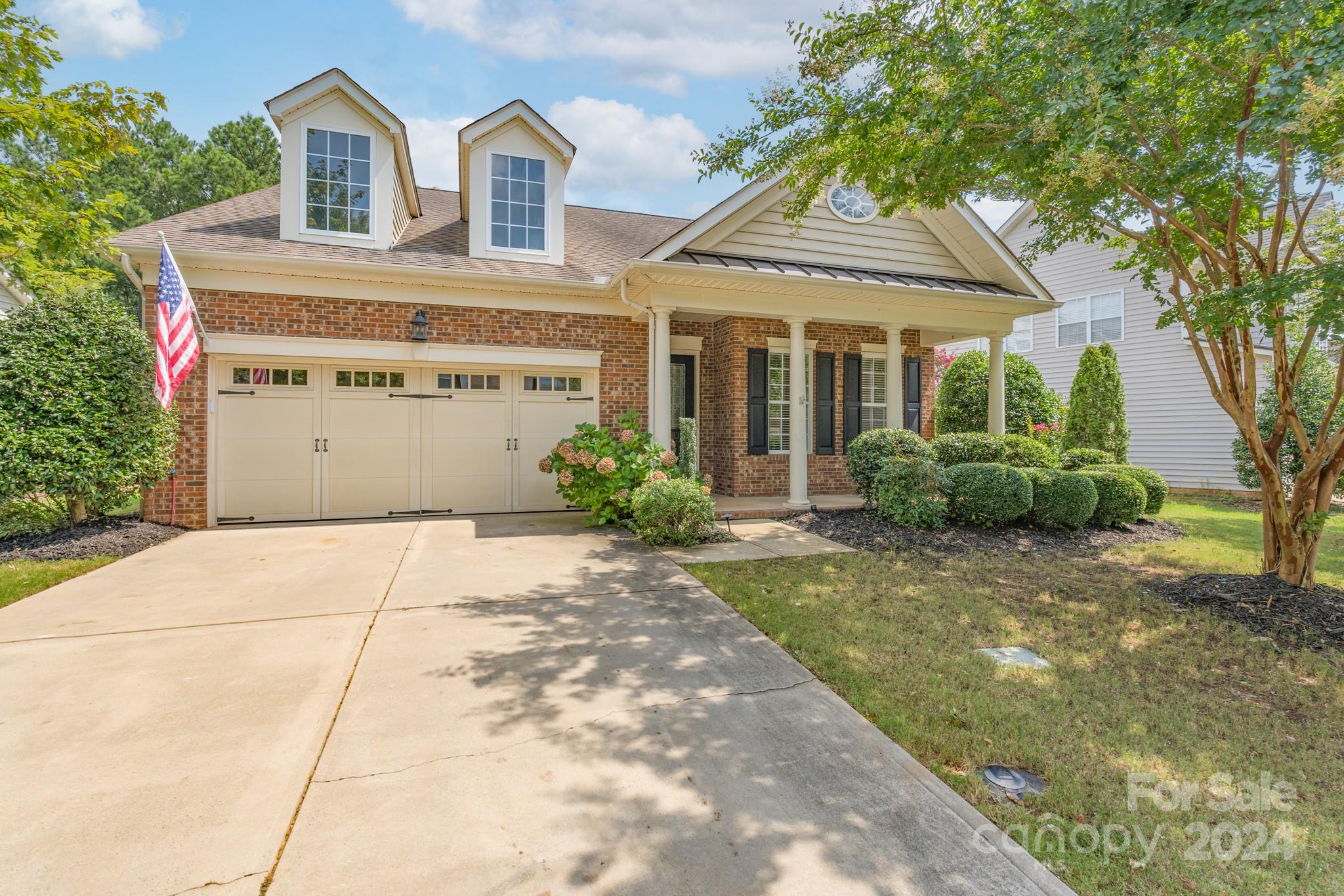 1385 Secret Path Drive Fort Mill, SC 29708 - Photo 1 of 48 a front view of a house with a garden