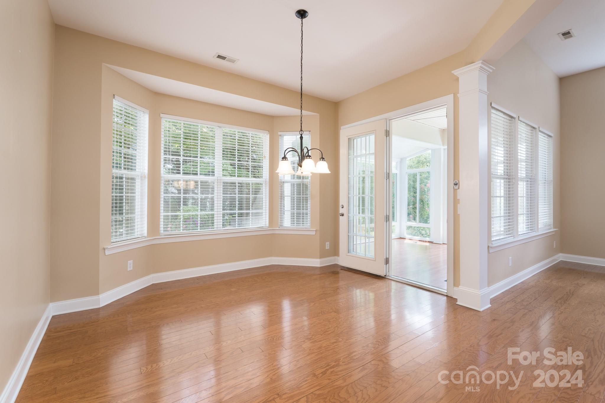1385 Secret Path Drive Fort Mill, SC 29708 - Photo 13 of 48 a view of a room with wooden floor and windows