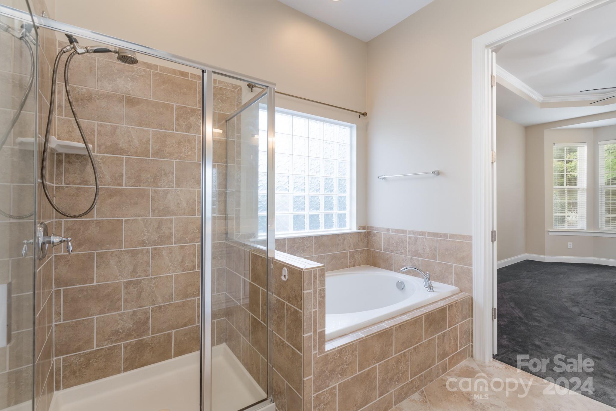 1385 Secret Path Drive Fort Mill, SC 29708 - Photo 27 of 48 a bathroom with a bath tub and shower