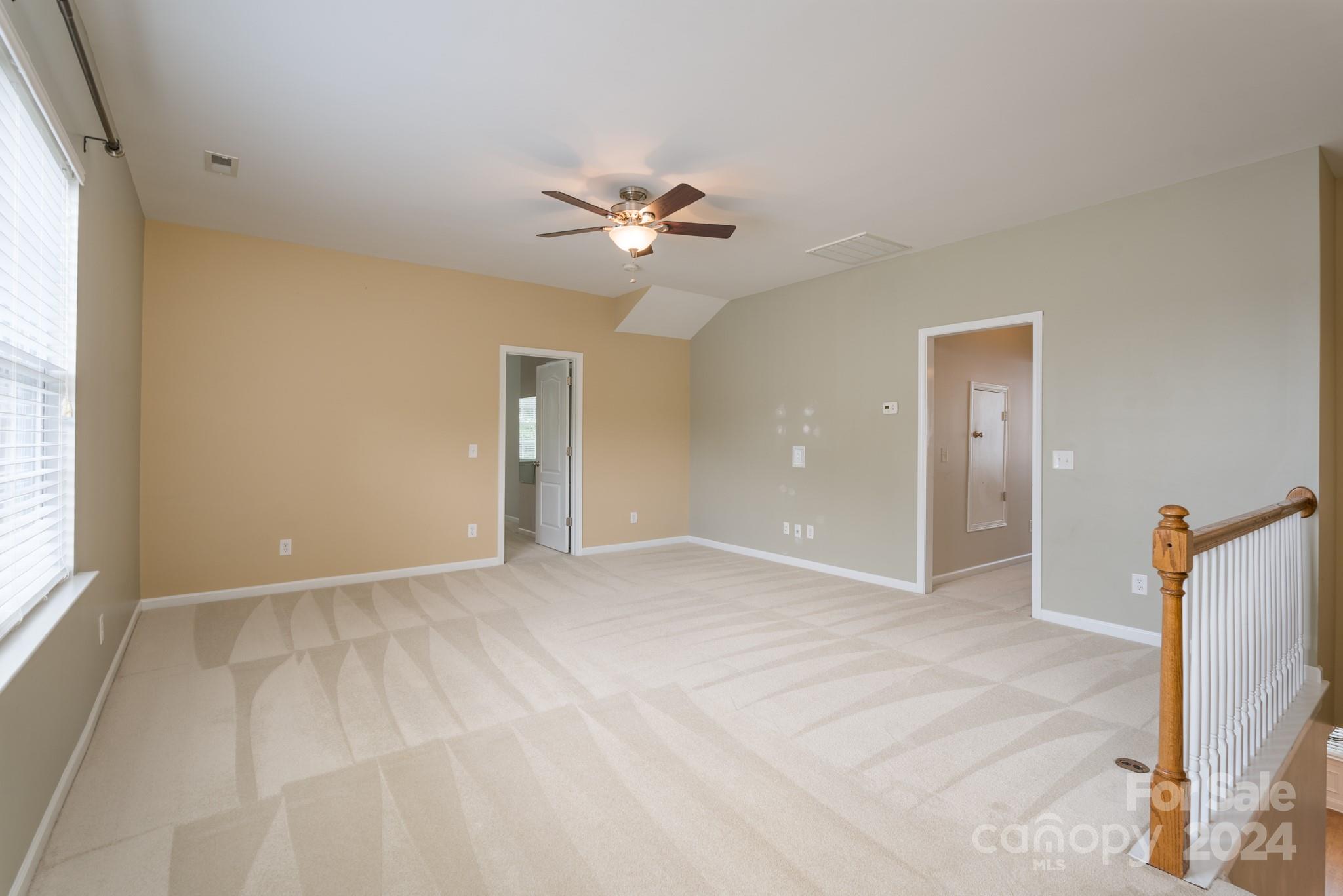 1385 Secret Path Drive Fort Mill, SC 29708 - Photo 28 of 48 wooden floor in an empty room with a window