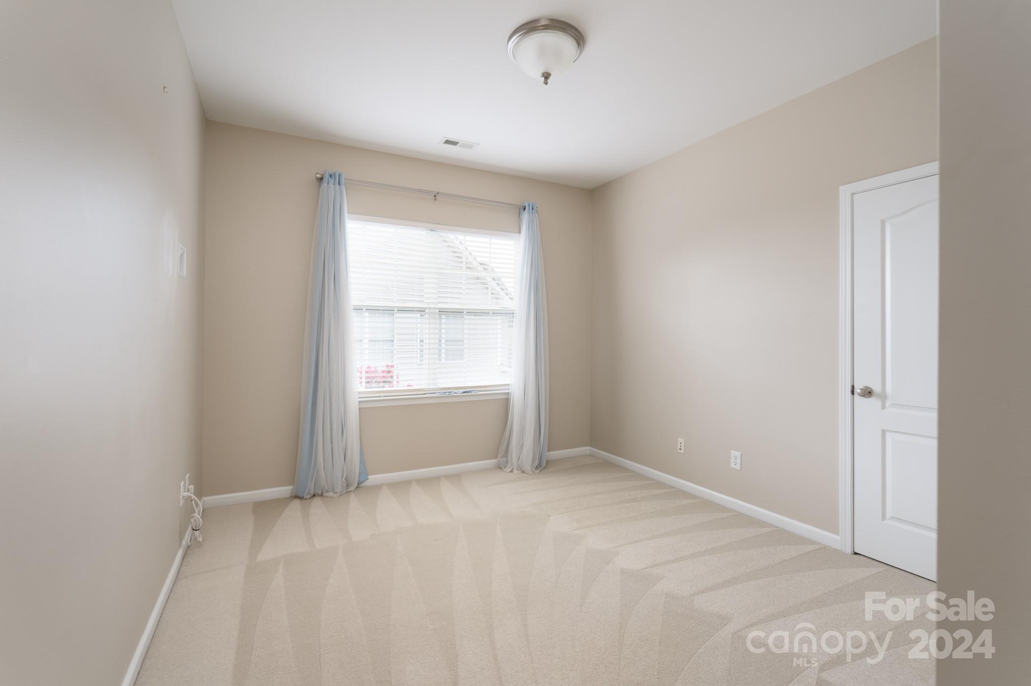 1385 Secret Path Drive Fort Mill, SC 29708 - Photo 30 of 48 a view of an empty room with a window