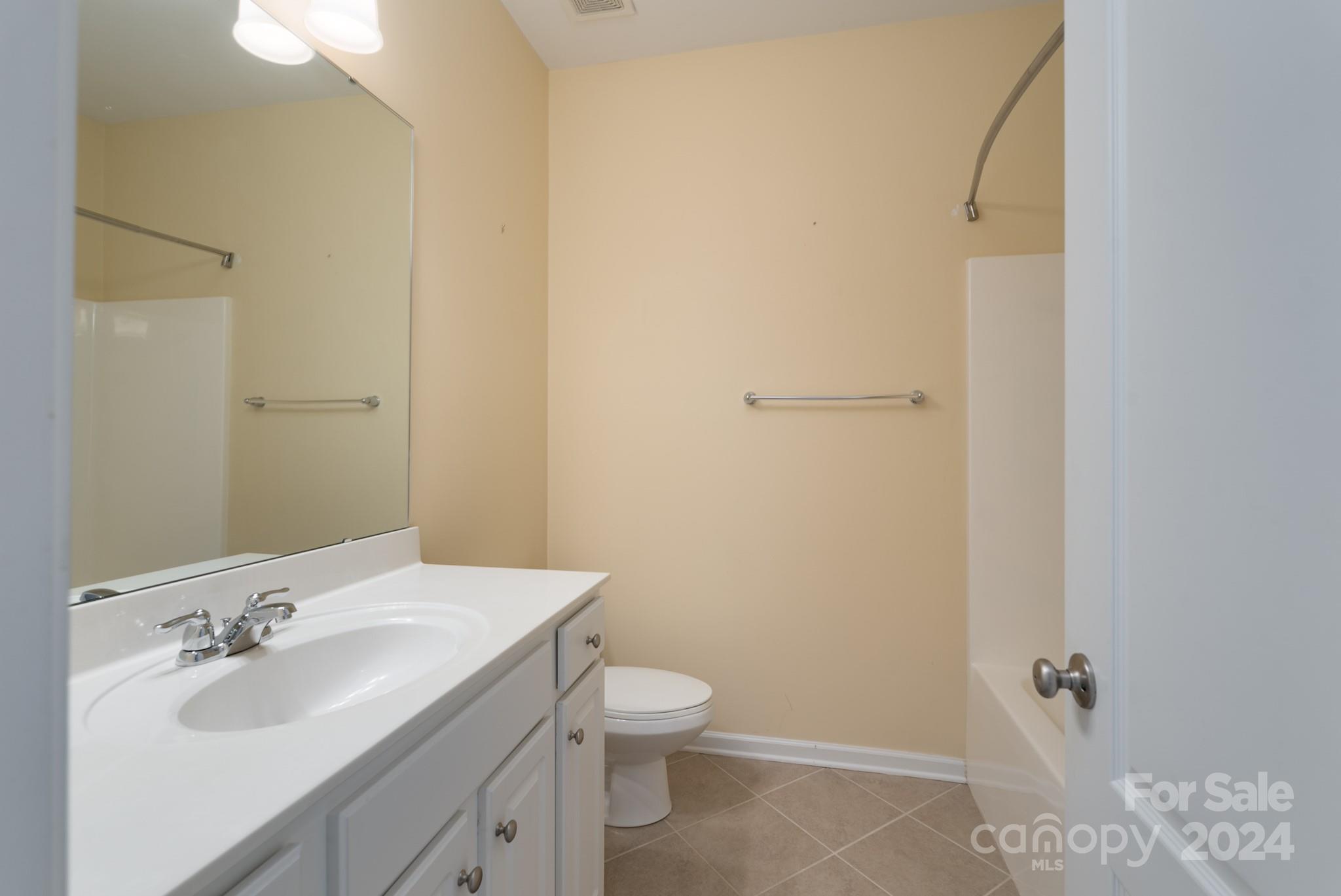 1385 Secret Path Drive Fort Mill, SC 29708 - Photo 31 of 48 a bathroom with a sink toilet and vanity
