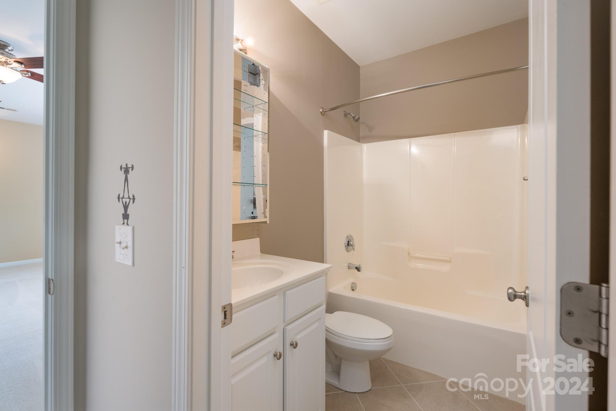 1385 Secret Path Drive Fort Mill, SC 29708 - Photo 33 of 48 a bathroom with a granite countertop sink toilet and shower