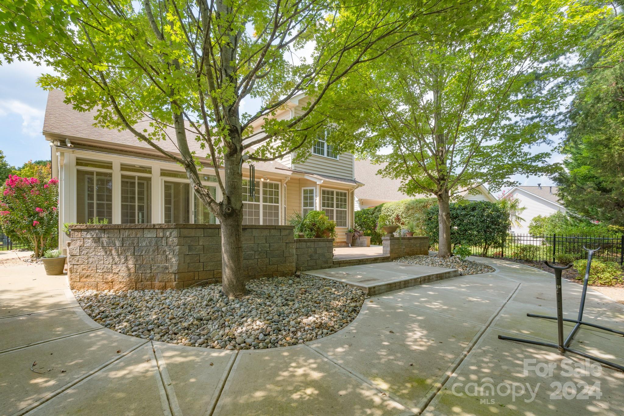 1385 Secret Path Drive Fort Mill, SC 29708 - Photo 38 of 48 a front view of a house with garden