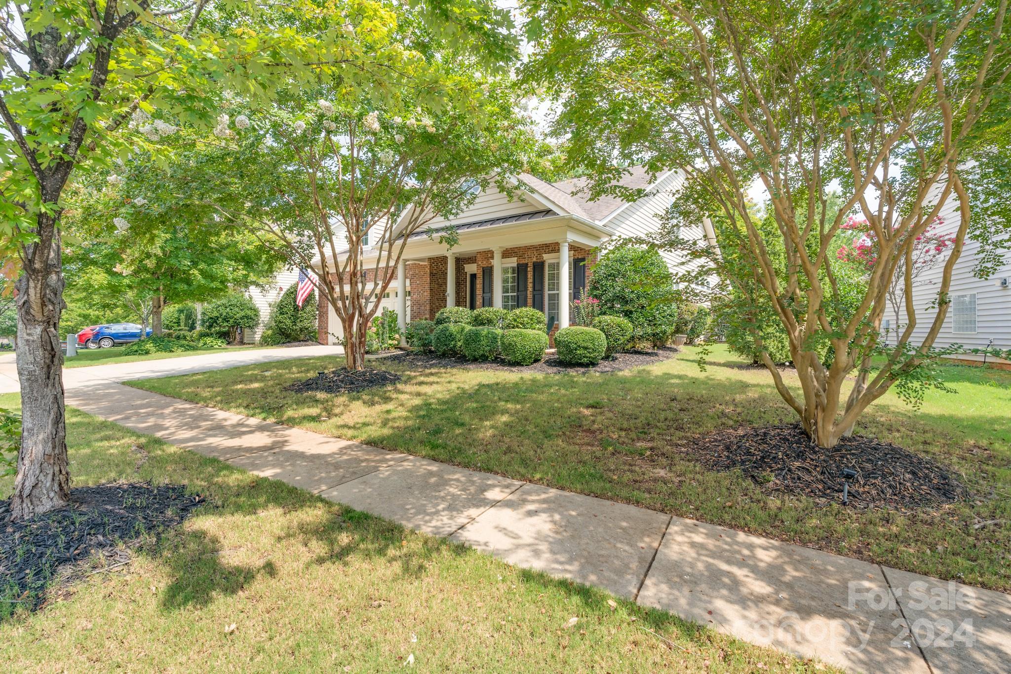 1385 Secret Path Drive Fort Mill, SC 29708 - Photo 4 of 48 a front view of a house with a yard and trees