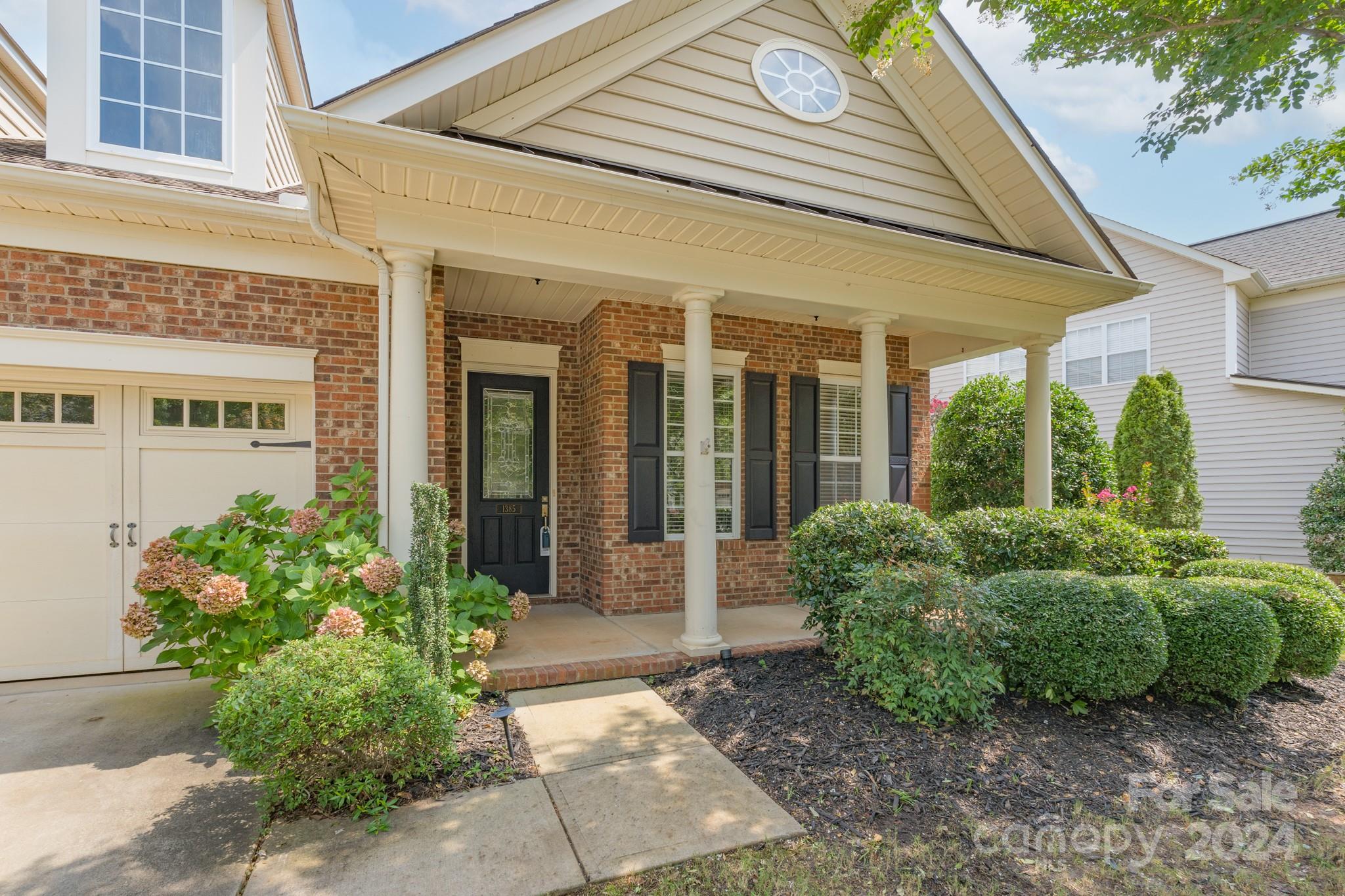 1385 Secret Path Drive Fort Mill, SC 29708 - Photo 5 of 48 a front view of a house with garden