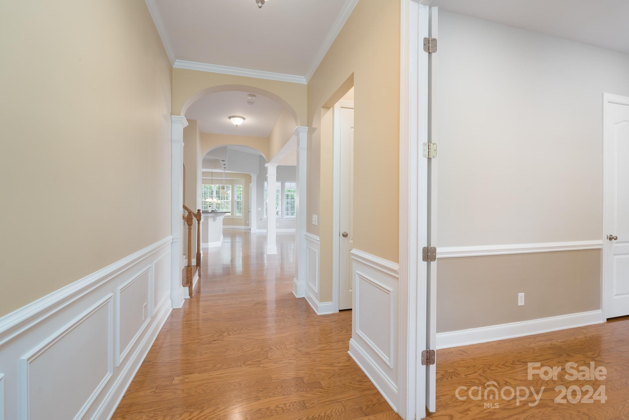 1385 Secret Path Drive Fort Mill, SC 29708 - Photo 6 of 48 a view of a hallway with wooden floor and staircase