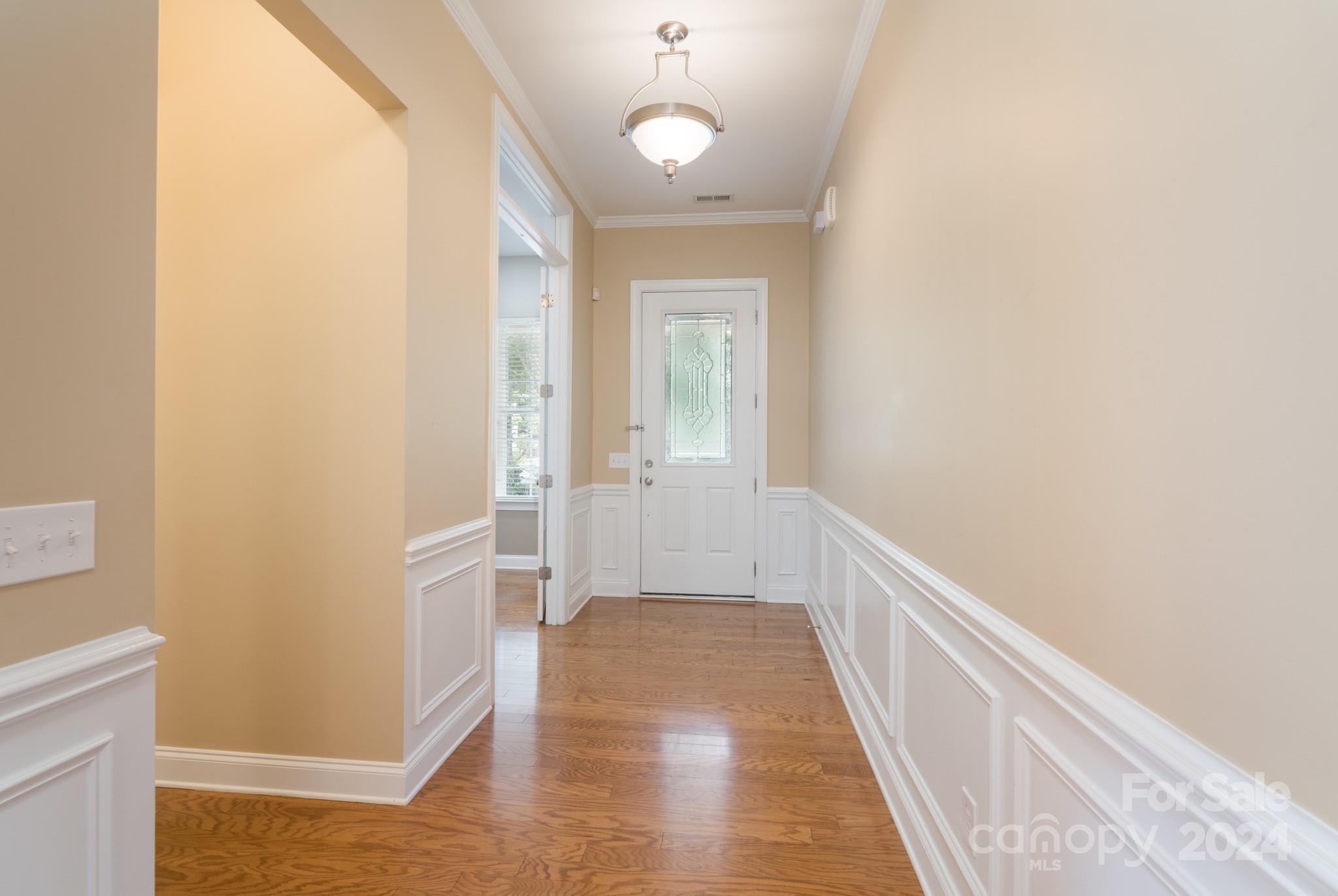 1385 Secret Path Drive Fort Mill, SC 29708 - Photo 7 of 48 a view of a hallway with wooden floor and a bathroom