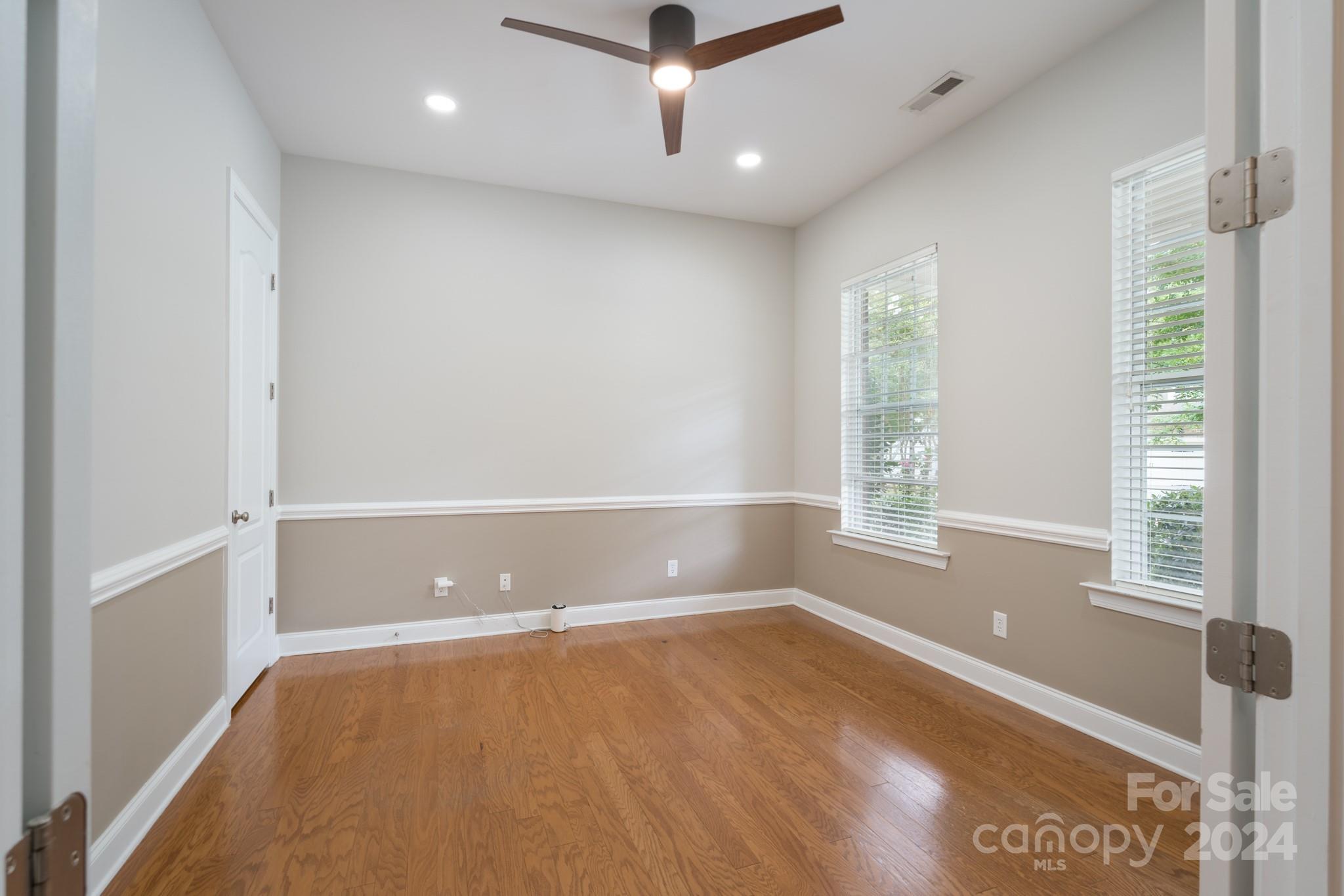 1385 Secret Path Drive Fort Mill, SC 29708 - Photo 9 of 48 wooden floor in an empty room with a window